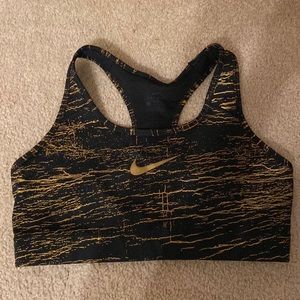 Nike sports bra size large good used condition Gold/Black in color.